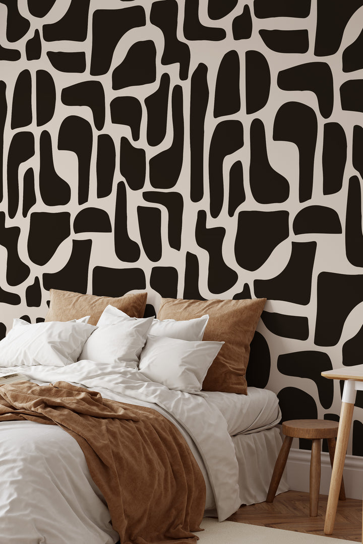 Black and beige abstract stone wallpaper in cozy bedroom