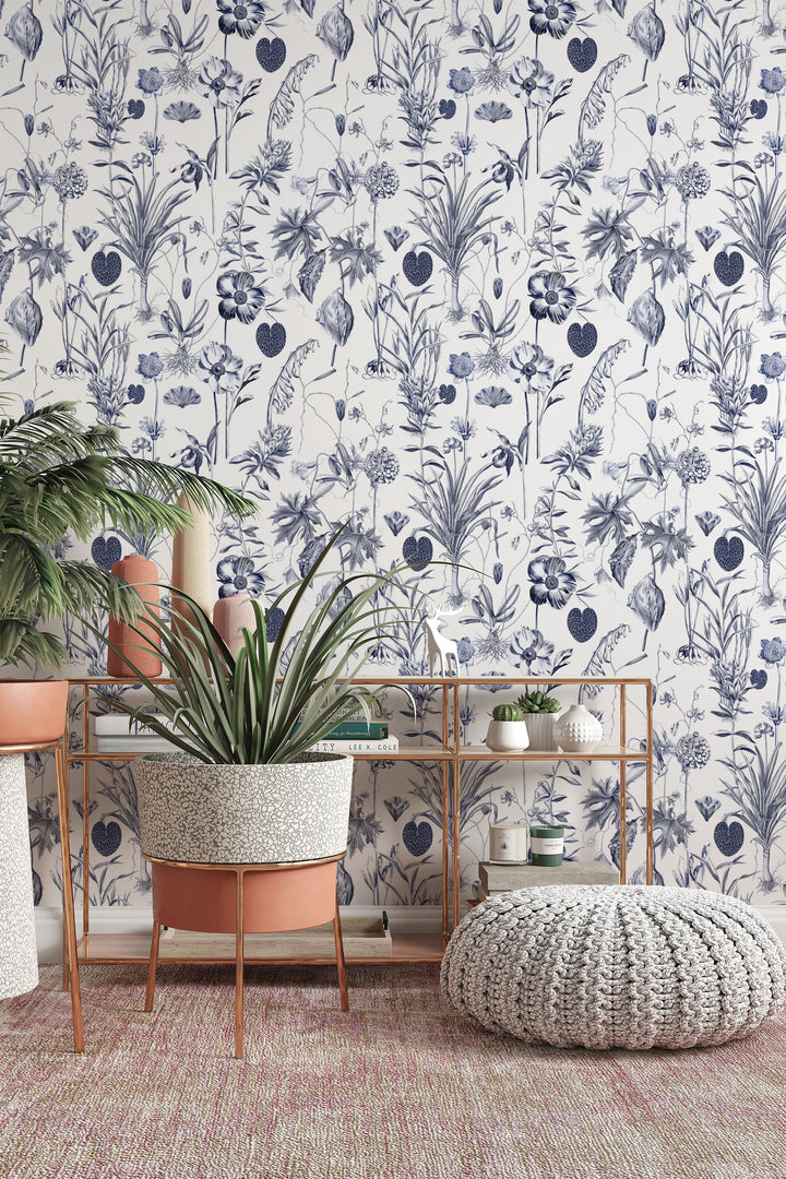 Blue botanical toile white wallpaper with plants, shelf, and cozy pouf