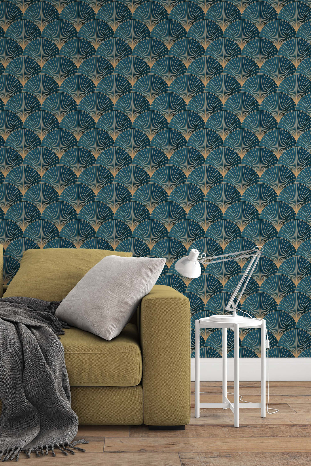 a cozy living room setting with a yellow sofa, a white side table with a lamp, and a patterned wallpaper with a repeating fan-like design in shades of blue and gold.