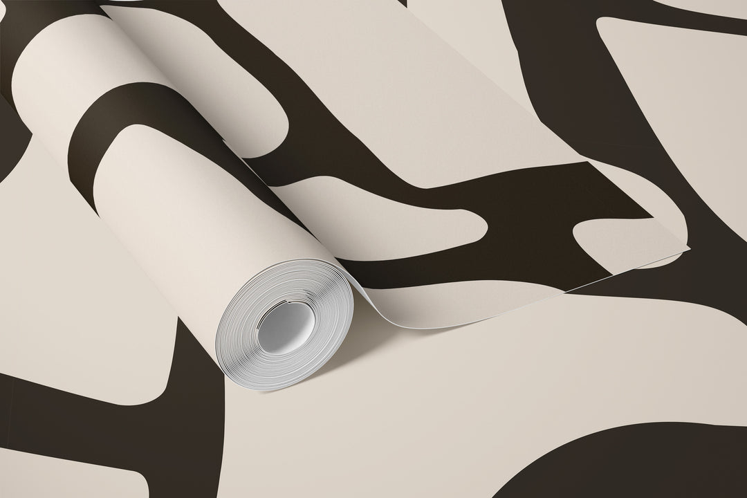 Roll of black and beige abstract stone wallpaper with bold curved pattern