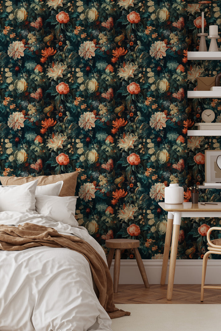 Cream and orange floral wallpaper on a dark teal background featured as a bedroom accent wall behind a bed, wooden desk, chair, and wall shelves.