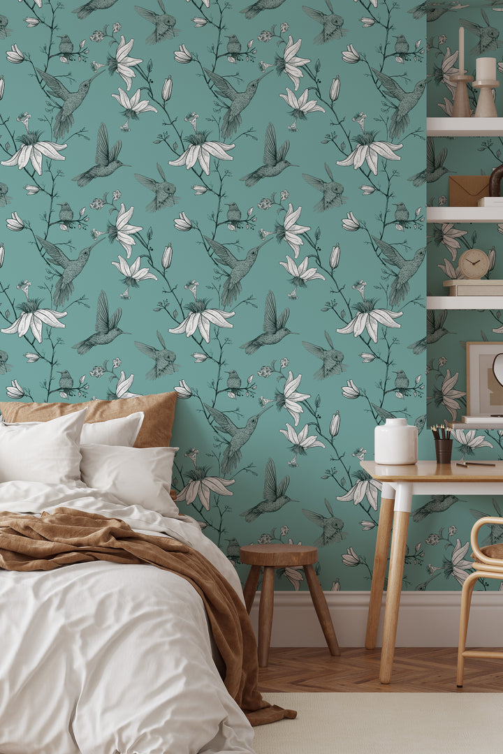 Cozy bedroom with wood desk and shelves featuring Aqua Green Hummingbird Wallpaper with a botanical floral bird pattern.