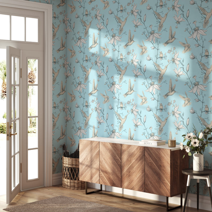 Entryway with light blue hummingbird and floral wallpaper featuring a vintage botanical pattern and mid-century modern wood cabinet