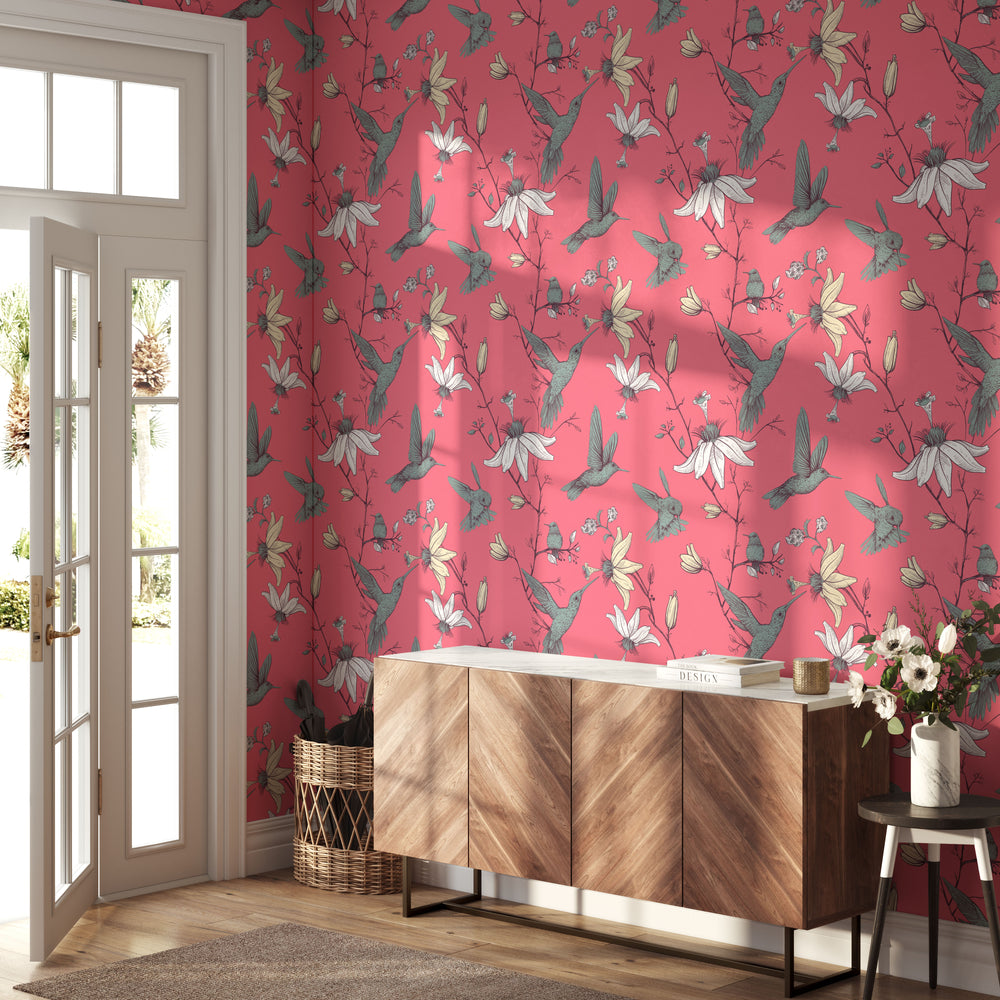 Coral Pink Hummingbird Wallpaper with Vintage Botanical Floral Bird Pattern in an Entryway with Wood Sideboard and Glass Door