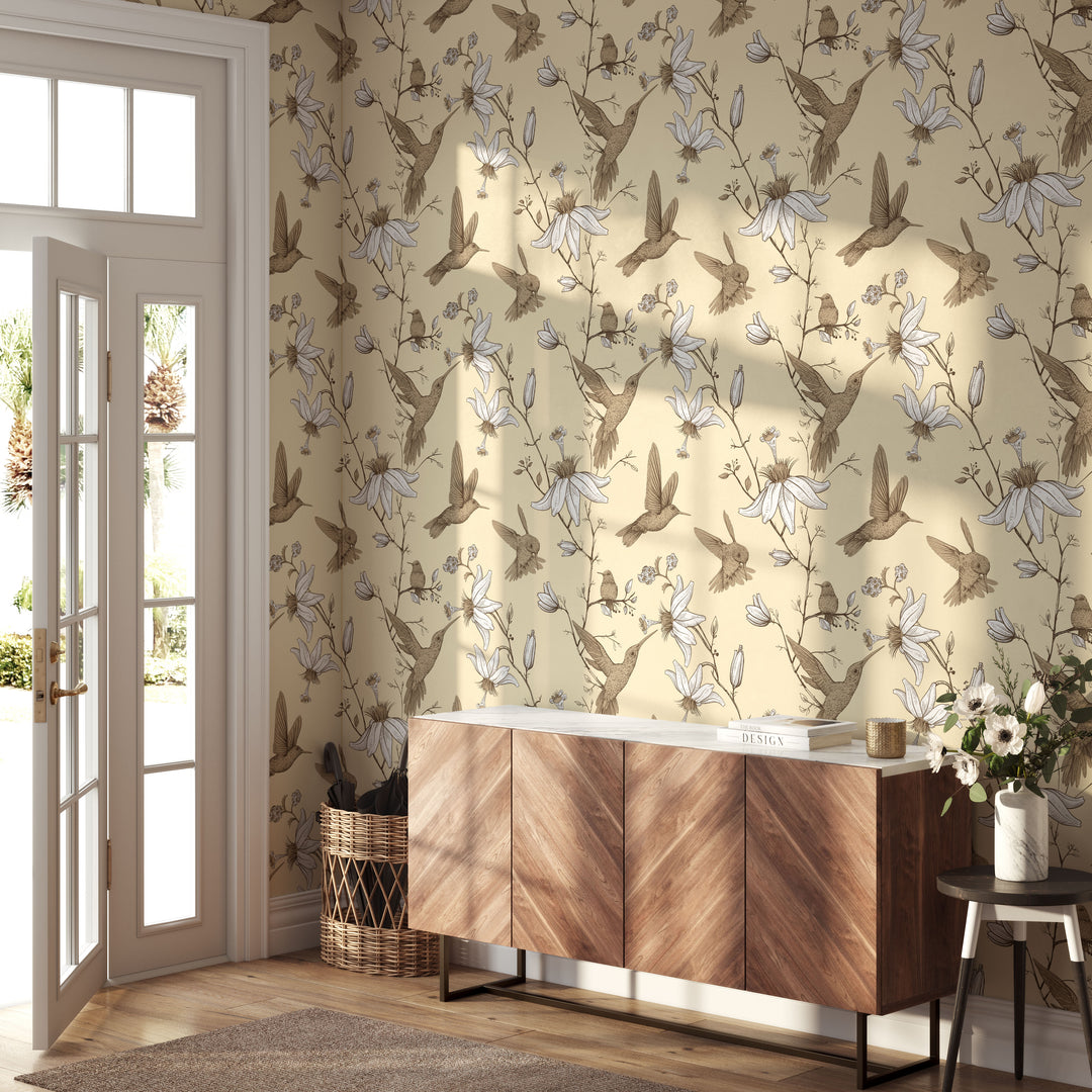 Cozy entryway with wood console table featuring cream hummingbird botanical floral wallpaper