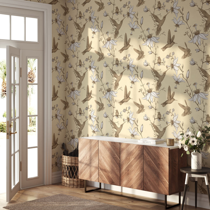 Cozy entryway with wood console table featuring cream hummingbird botanical floral wallpaper