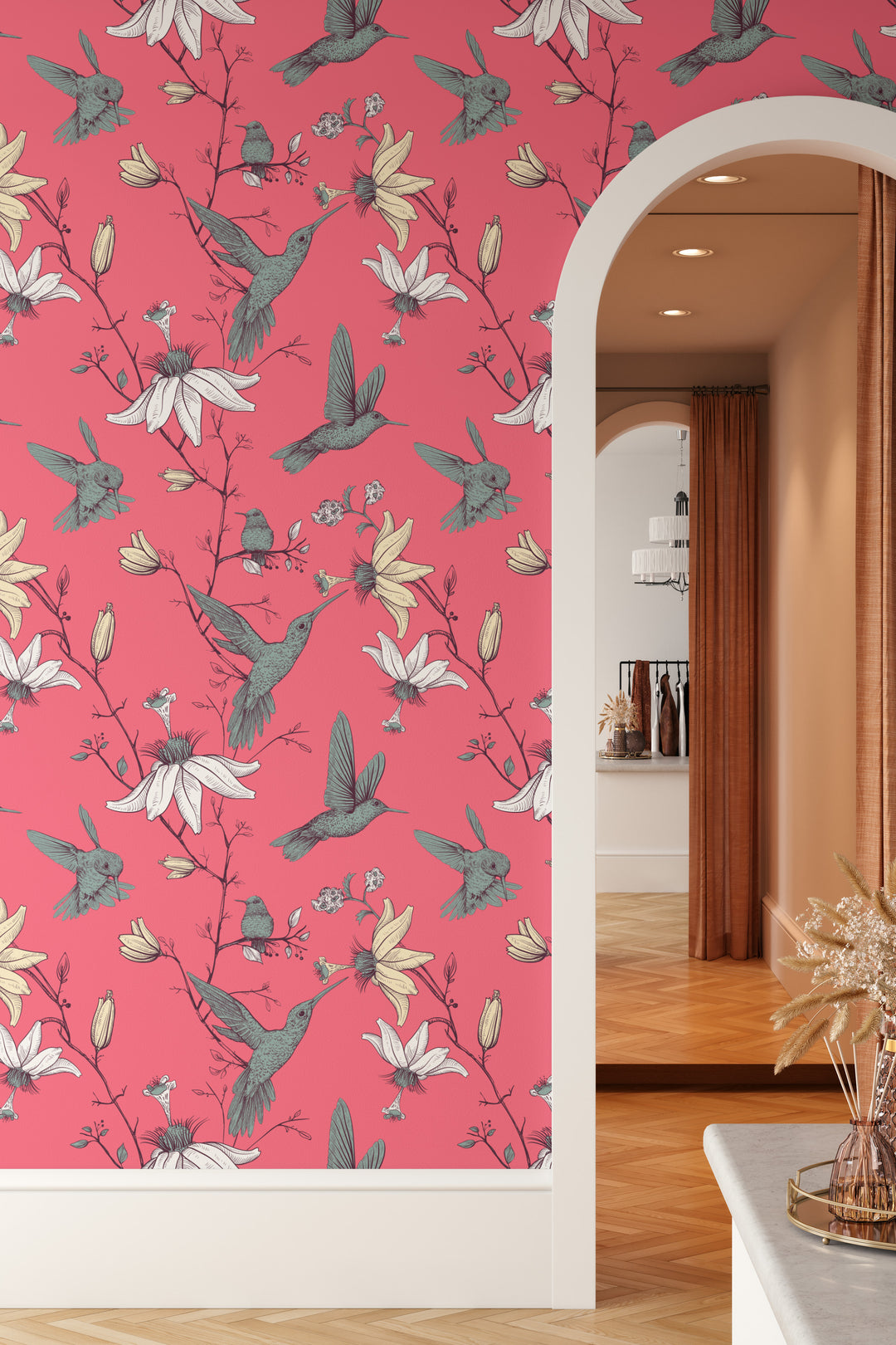 Coral Pink Hummingbird Wallpaper on an arched doorway wall with a botanical floral bird pattern.