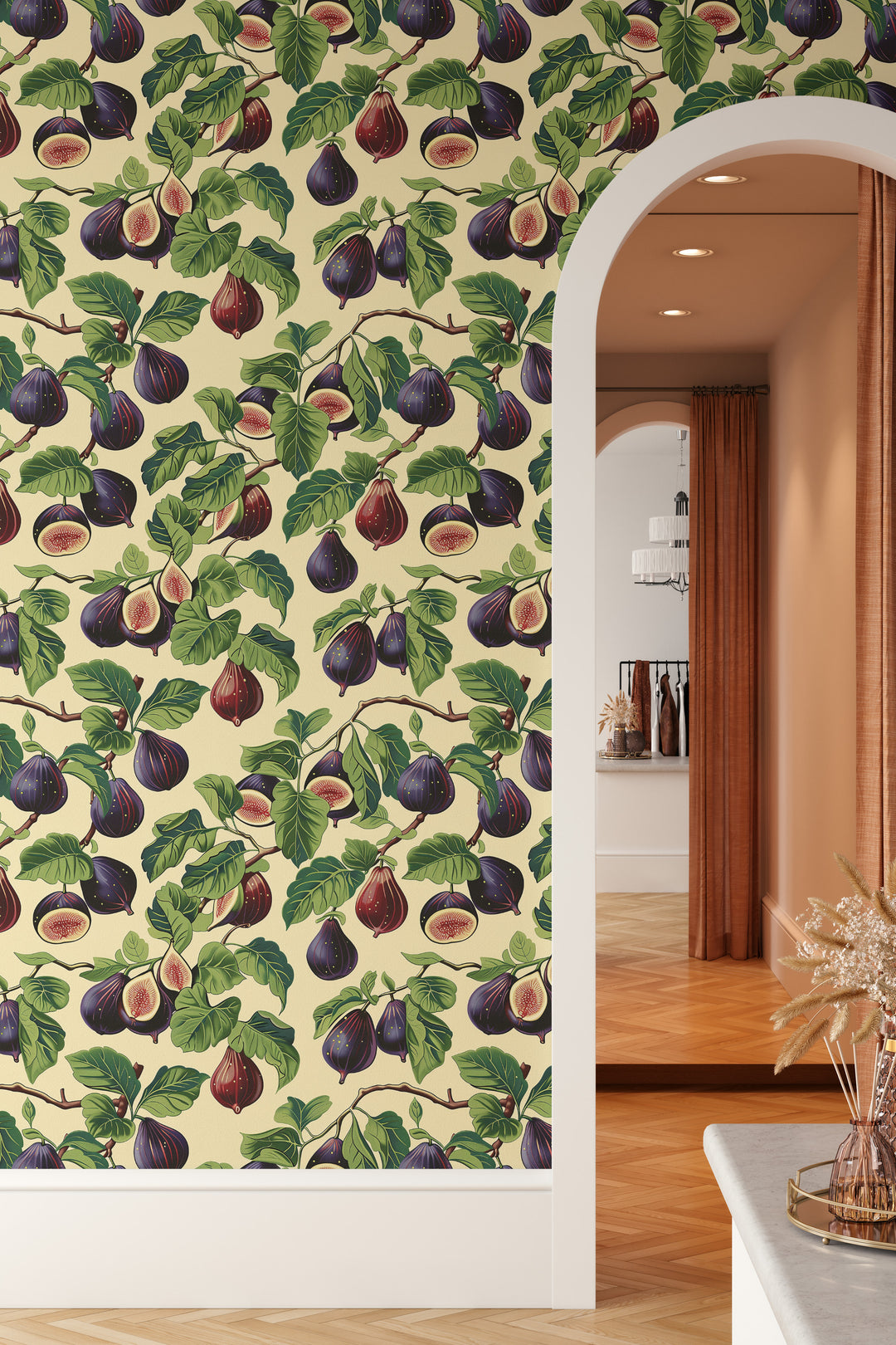 Cream purple fig wallpaper with a bright green botanical pattern shown on an arched wall in a warm interior.