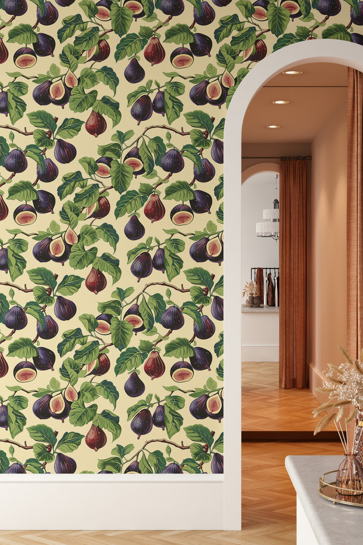 Cream purple fig wallpaper with a bright green botanical pattern shown on an arched wall in a warm interior.