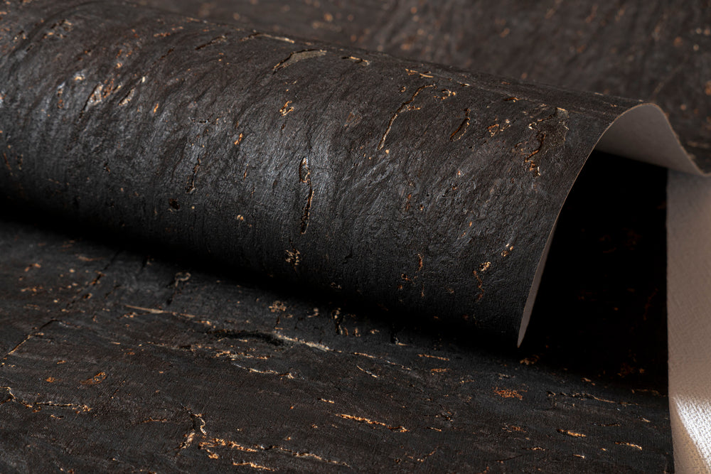 Roll of dark textured paper or fabric