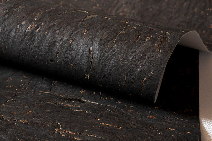 Roll of dark textured paper or fabric