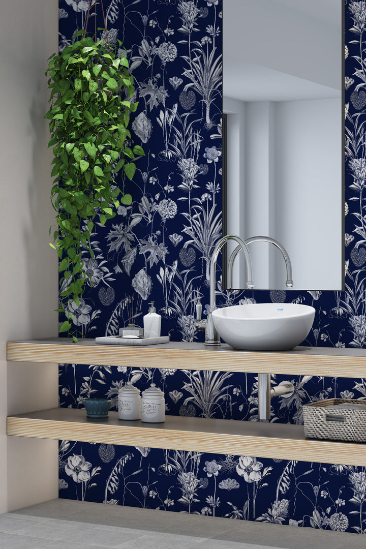 Midnight blue botanical toile wallpaper with bathroom sink, mirror, and hanging plant