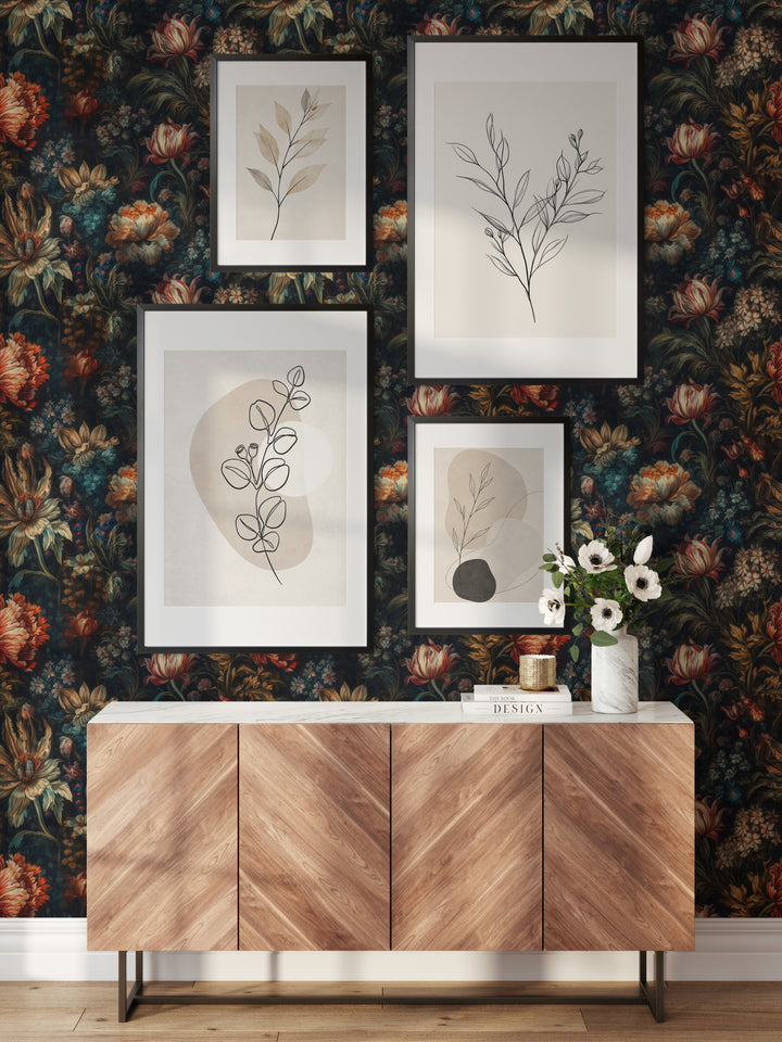 Dahlia Wallpaper Red & Cream Vintage Floral Pattern in a stylish living room with framed botanical artwork and a wooden console.