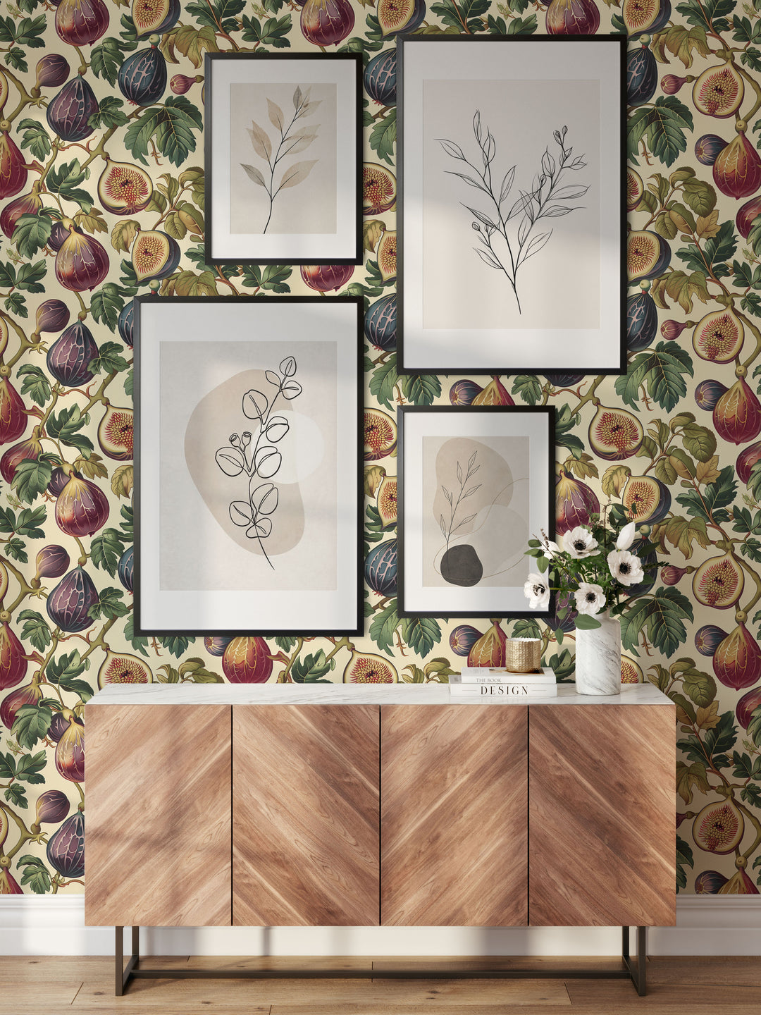 Cream fig and leaf wallpaper with vintage plum botanical pattern in a stylish entryway with picture frames.