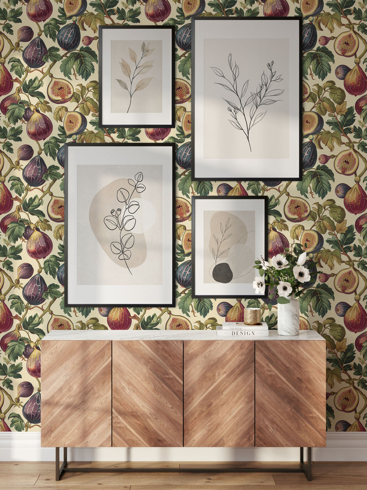 Cream fig and leaf wallpaper with vintage plum botanical pattern in a stylish entryway with picture frames.