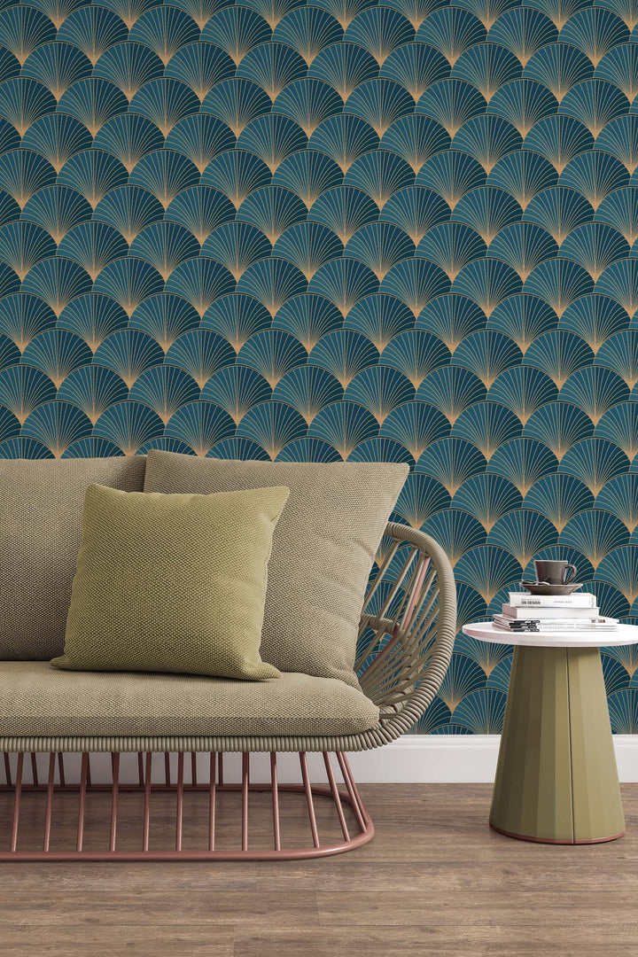 a living room with a sofa, a small side table, and a patterned wallpaper. The sofa has a yellow pillow on it, and the wall behind the sofa has a repeating pattern of blue and gold designs.