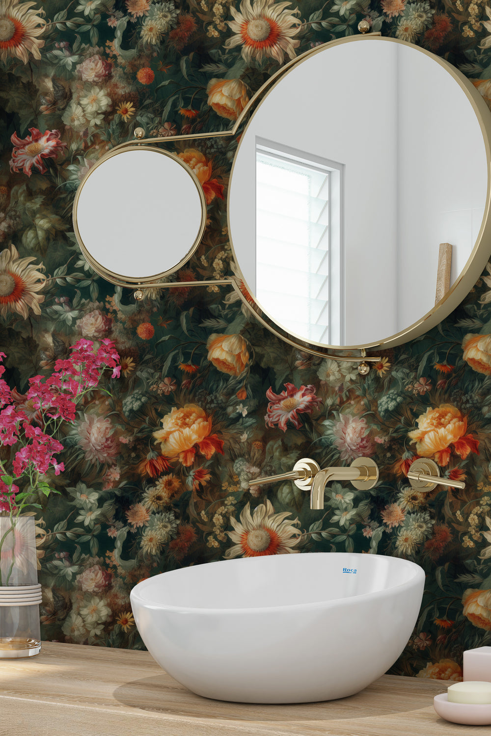 Warm orange and cream vintage floral wallpaper featuring layered blooms and lush greenery, showcased in an elegant bathroom with a white vessel sink, brass fixtures, and round mirrors.