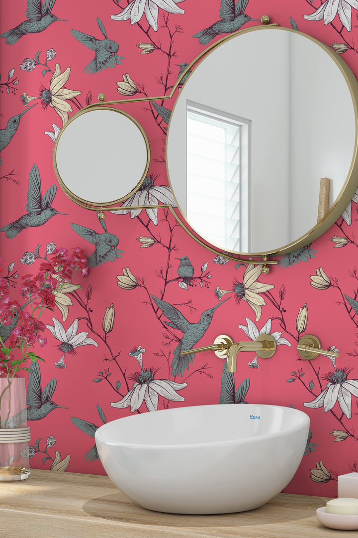 Coral Pink Hummingbird Wallpaper in a Stylish Bathroom with Gold Mirrors and a White Vessel Sink