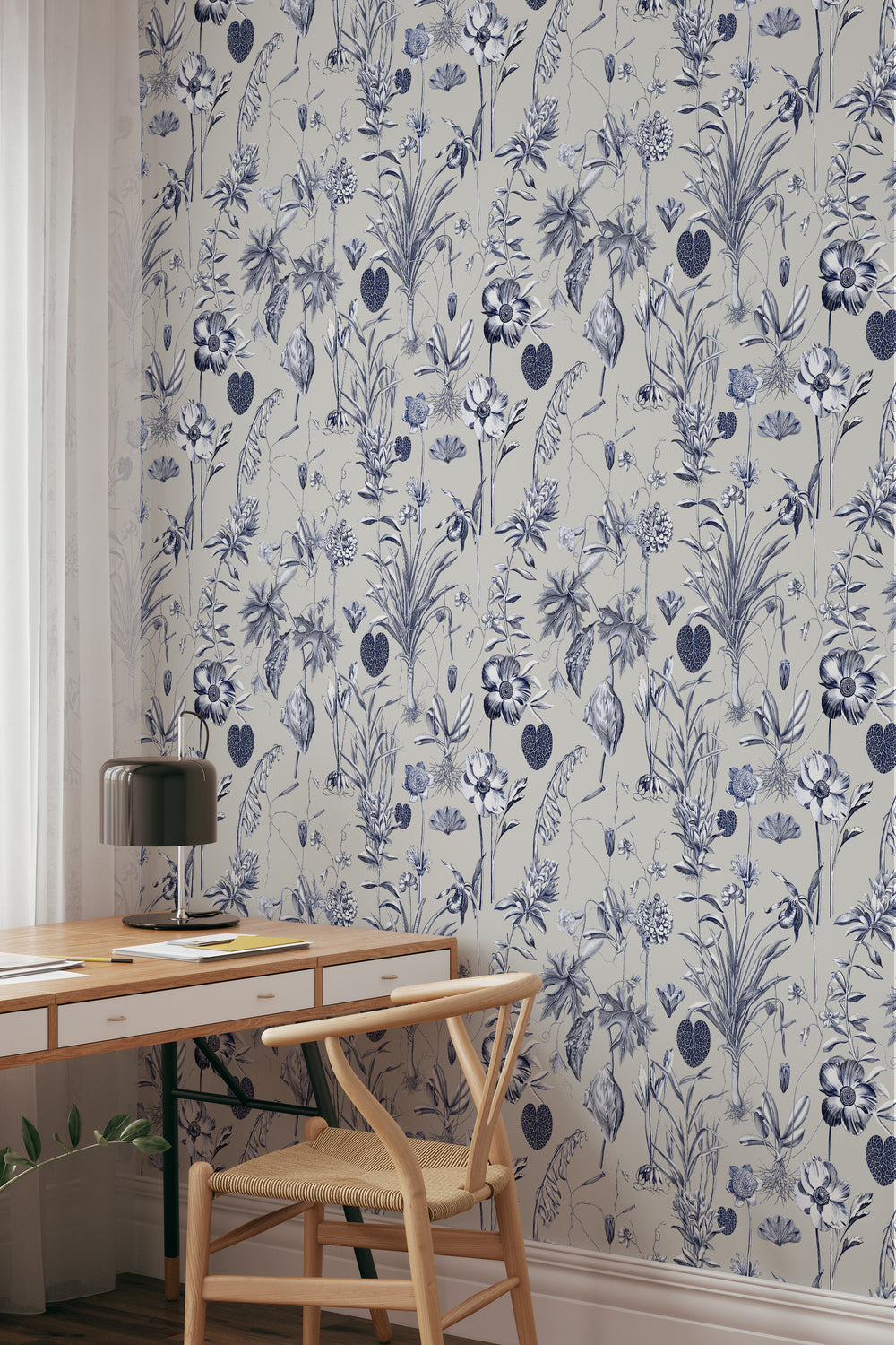 Blue and white floral wallpaper on a beige background with desk and chair
