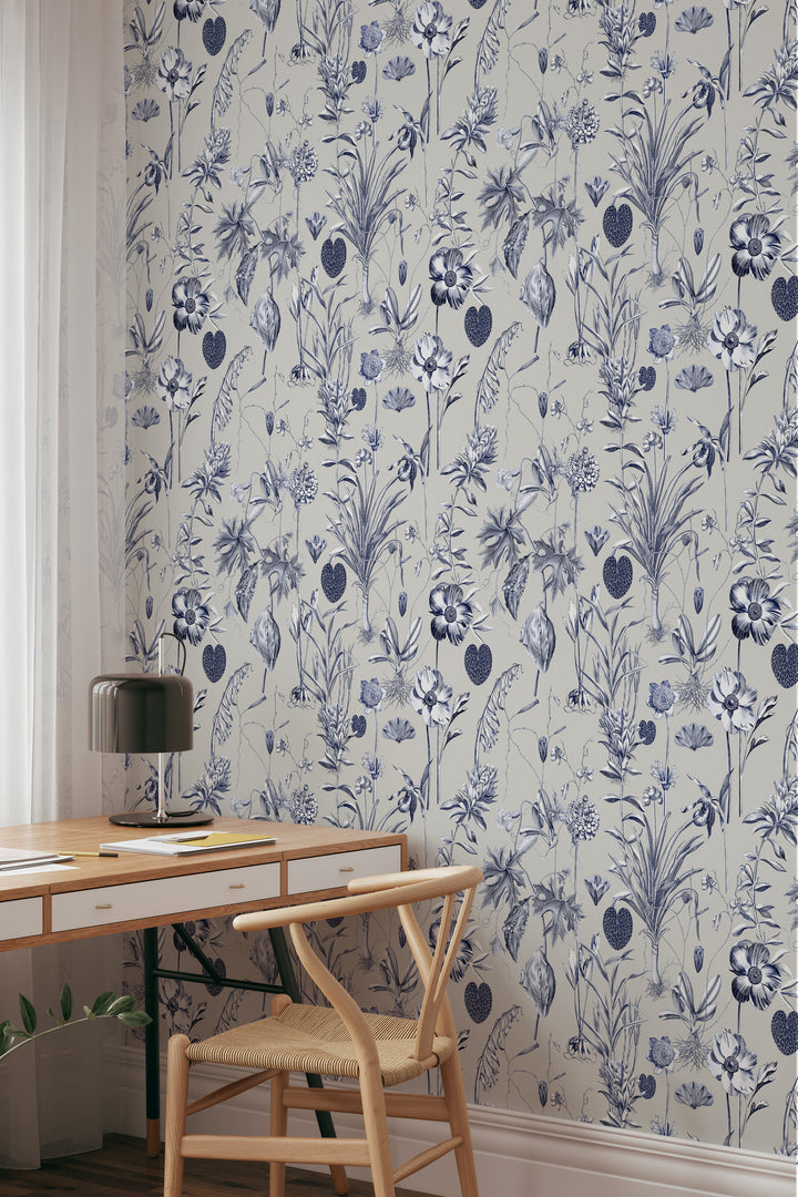 Blue and white floral wallpaper on a beige background with desk and chair