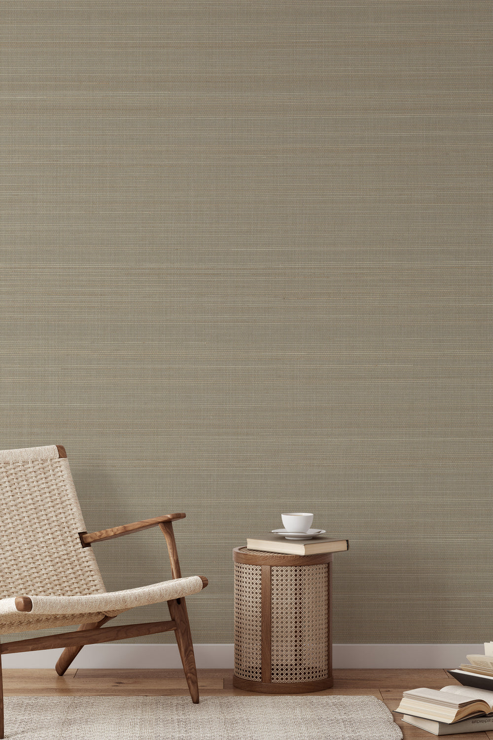 Woven armchair with a book on soft beige faux abaca grasscloth texture