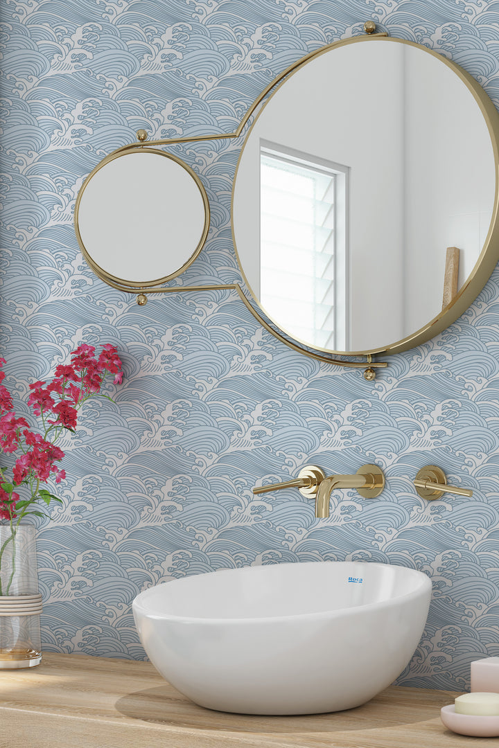Bathroom with cool blue Japanese wave wallpaper featuring a calm ocean pattern and modern gold accents