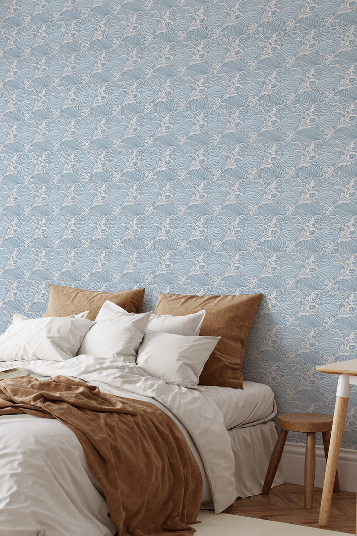 Bedroom with cool blue Japanese wave wallpaper featuring a calm ocean pattern and warm neutral decor