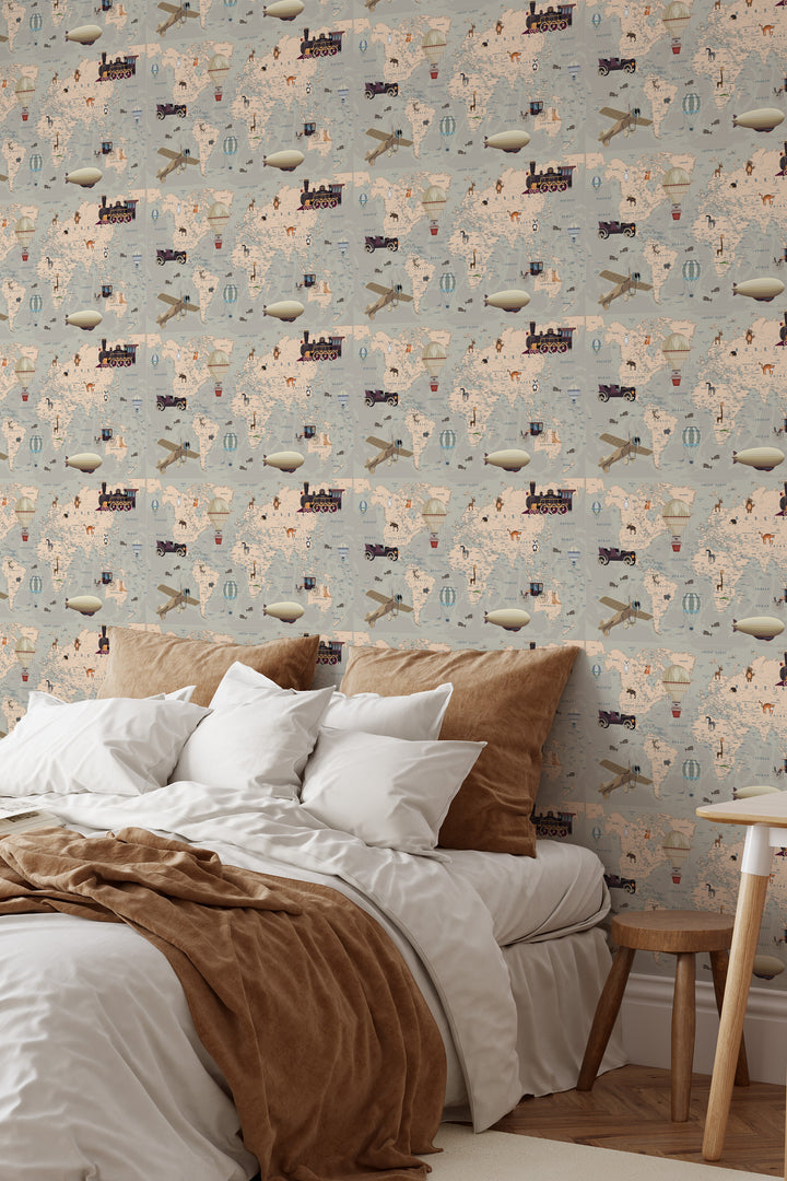 Gray beige world map wallpaper with vintage travel illustrations, airplanes, hot air balloons, and adventure elements in a cozy bedroom