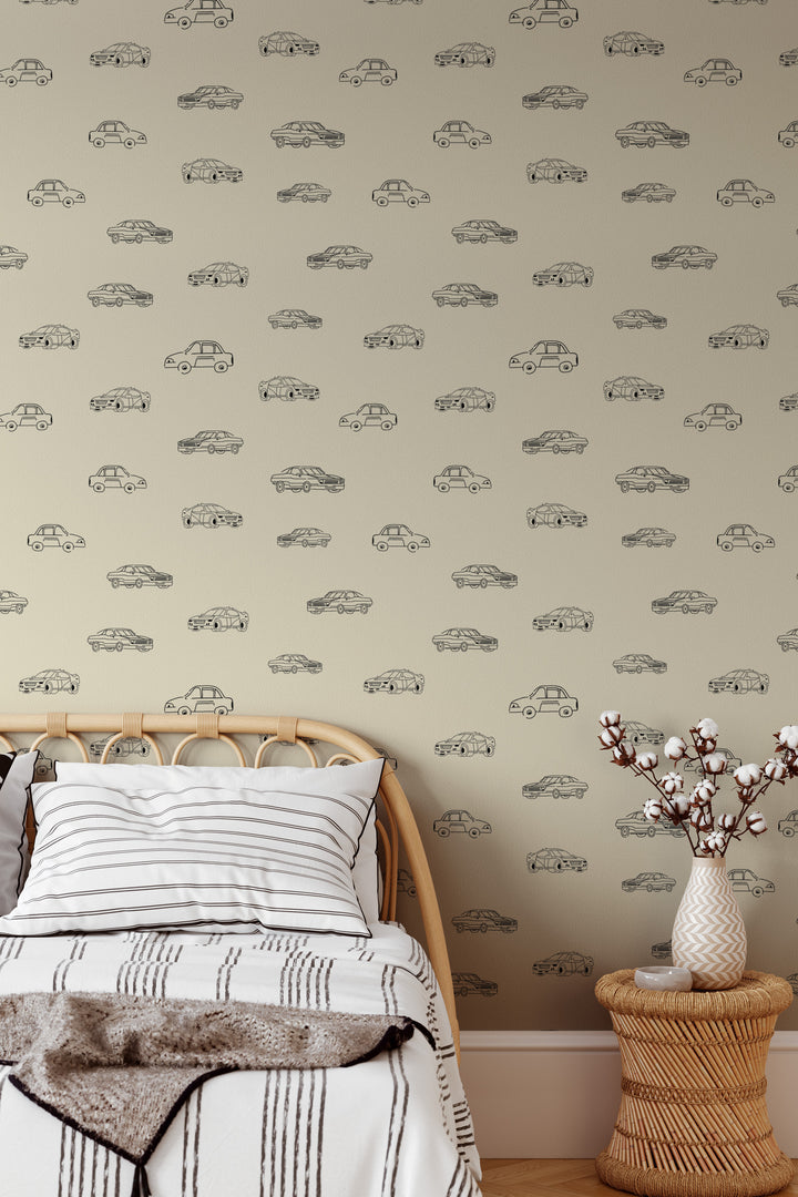 Bedroom with beige vintage car wallpaper, black line art vehicle pattern, rattan bed, and neutral decor