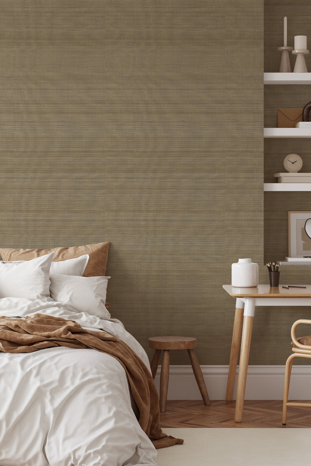 Bedroom interior with bed, pillows, wooden stool, desk and shelves on warm light brown Faux Abaca woven texture wallpaper.