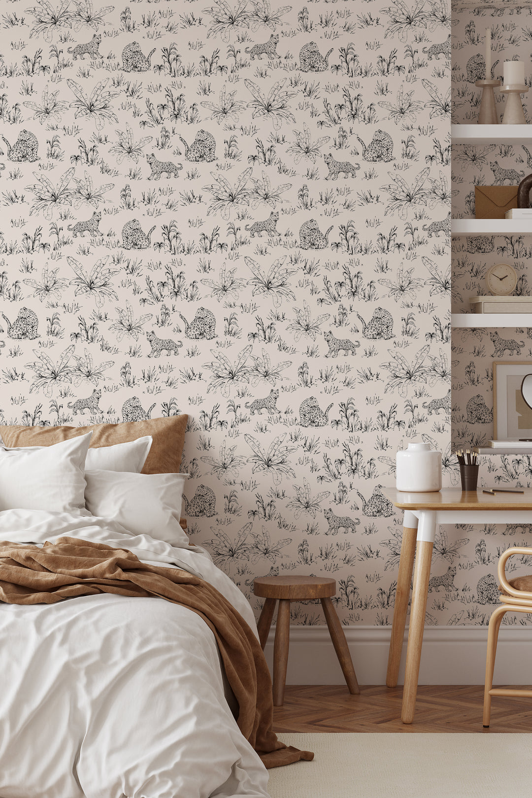 Beige safari leopard wallpaper with black tropical leaf line art in bedroom with side table and shelf