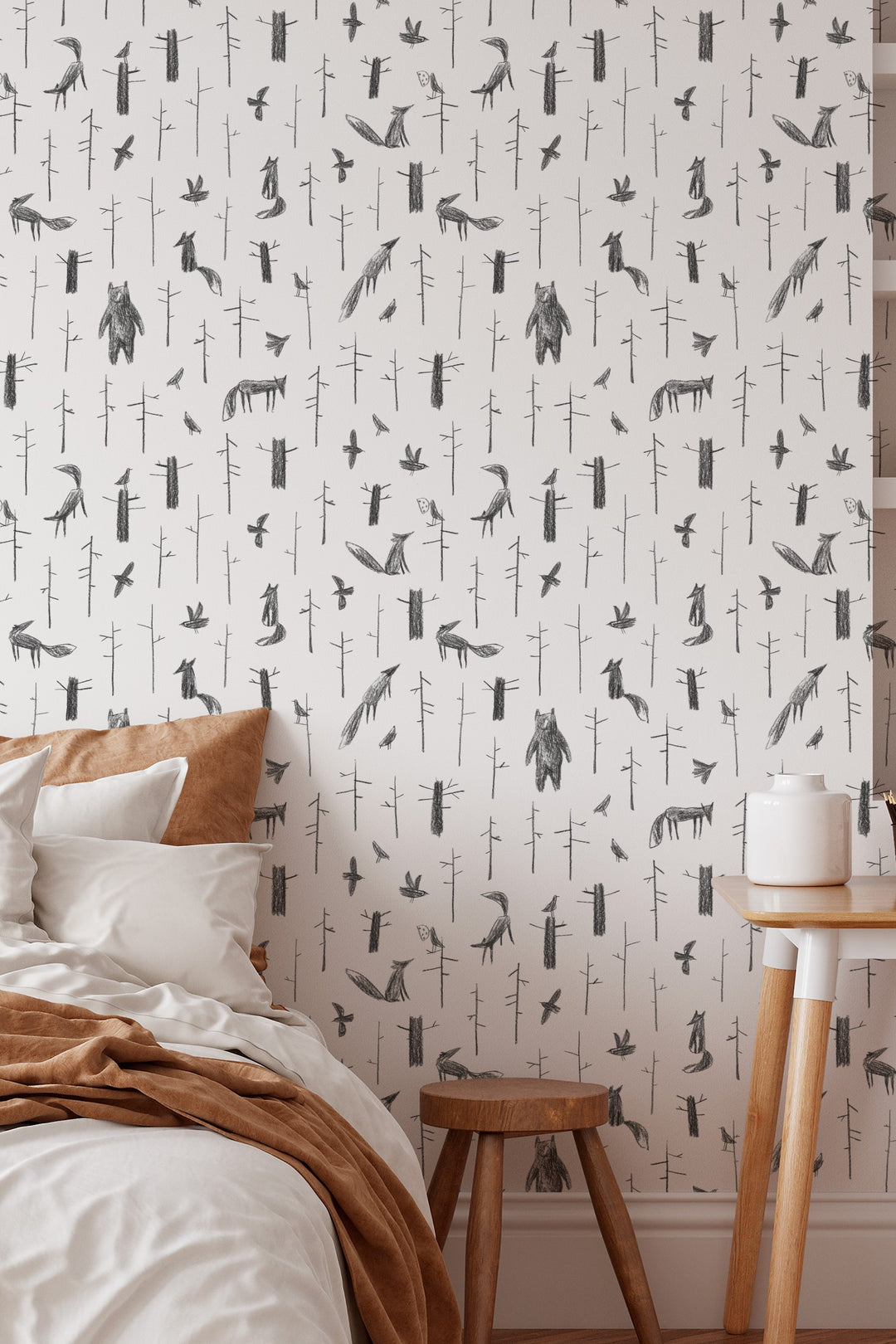 Wallpaper with animal pattern on a wall with a chair and table.