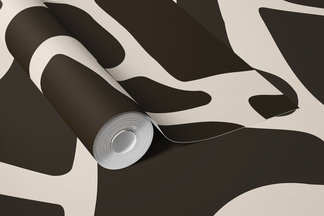 Roll of beige and black abstract stone wallpaper with bold curved pattern