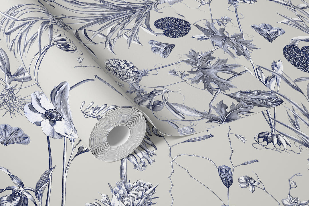 Roll of floral wallpaper with blue and white design on a beige background
