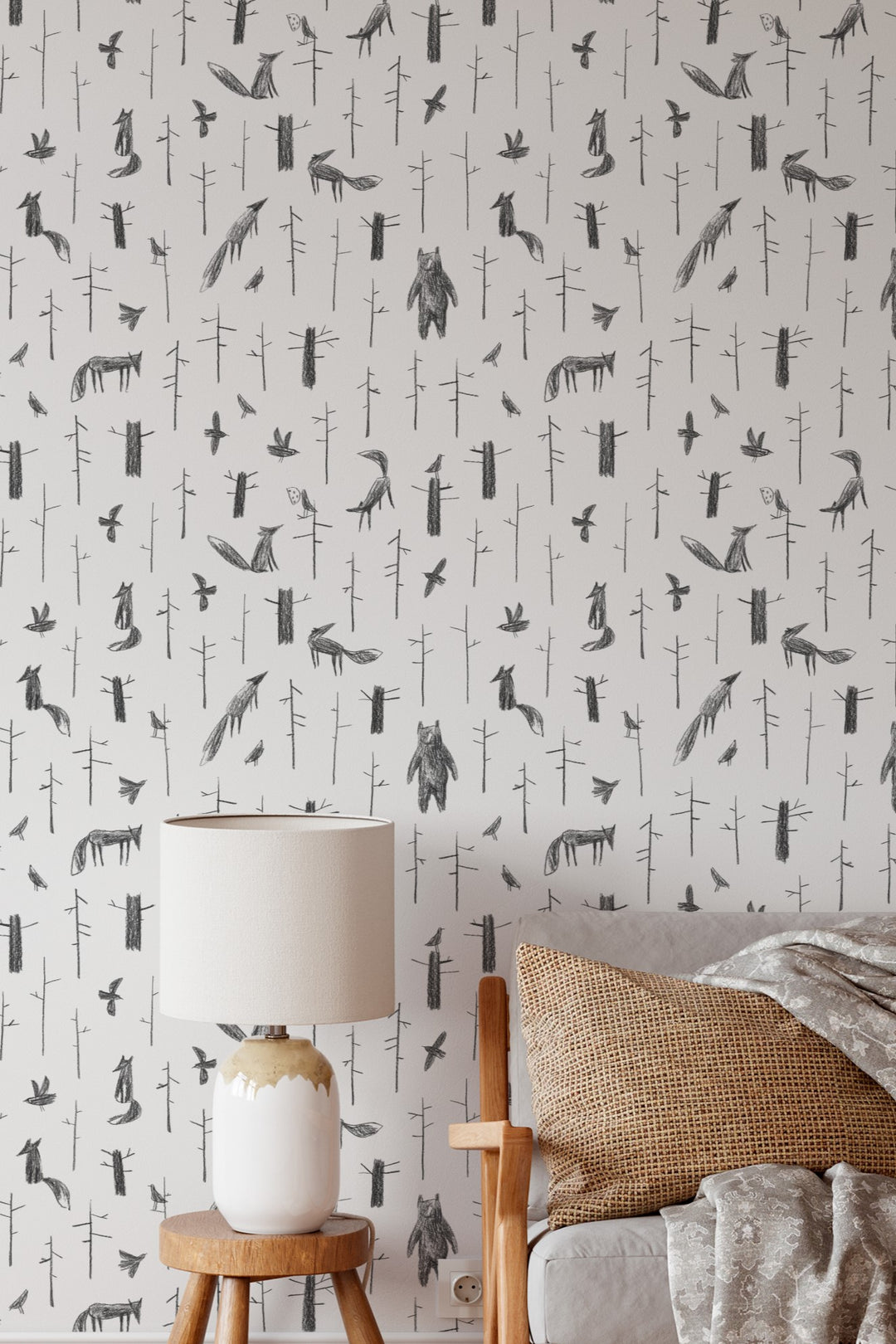 Wallpaper with animal pattern on a wall with a chair and table.