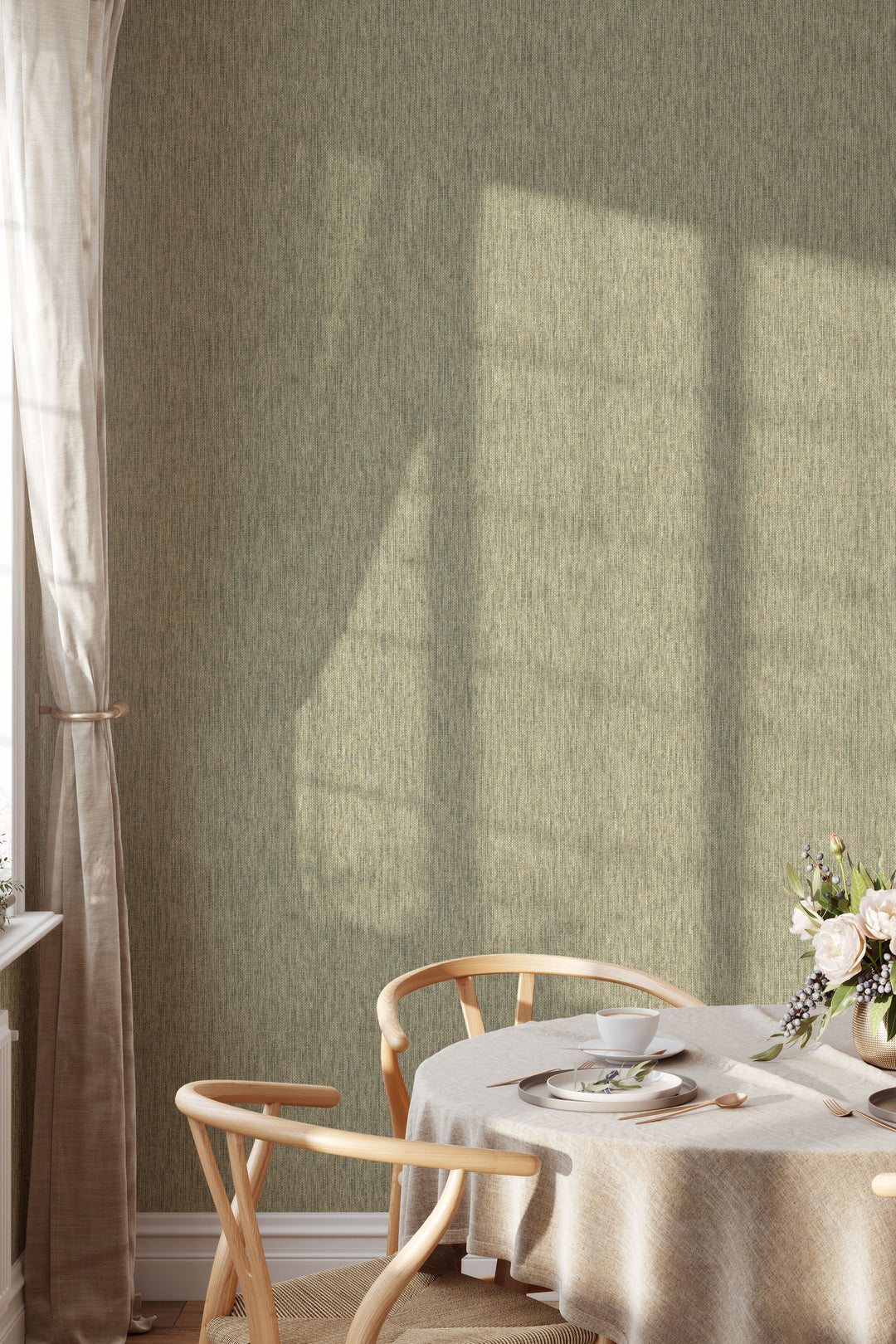 Dining area with round table, woven chairs and flowers against faux paper weave wallpaper in natural beige and muted olive green woven texture
