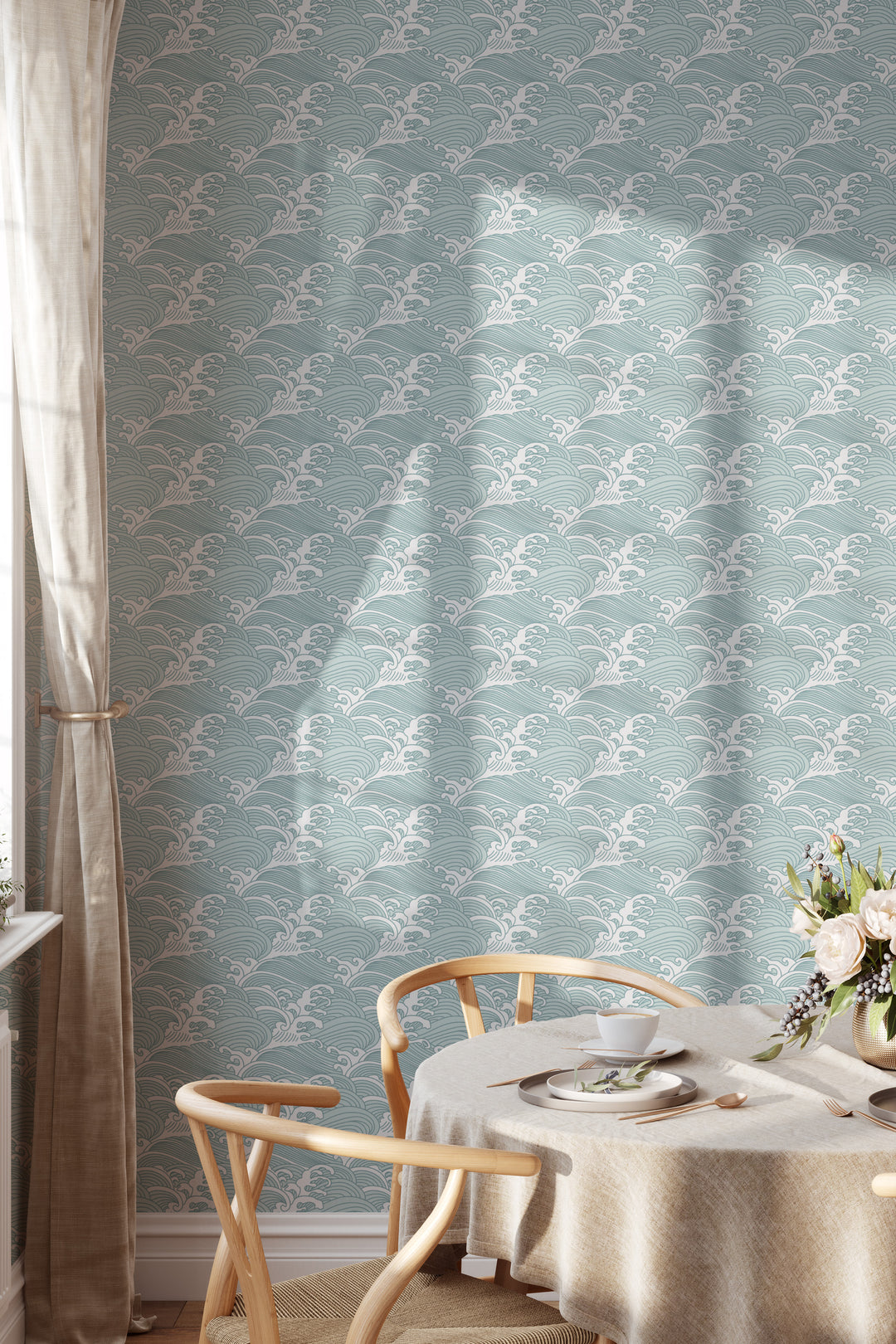 Dining room with aqua blue Japanese wave wallpaper featuring a traditional ocean pattern and warm natural decor