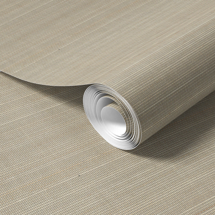 Roll of soft beige faux abaca grasscloth wallpaper with subtle grid texture