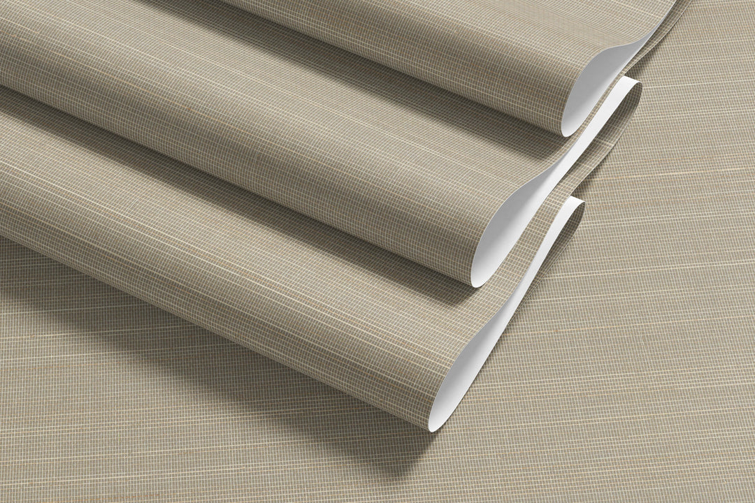 Roll of soft beige faux abaca grasscloth wallpaper with fine grid texture