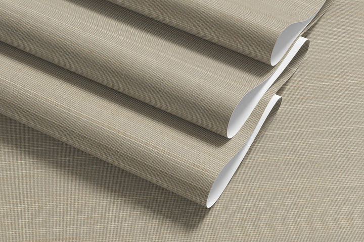 Roll of soft beige faux abaca grasscloth wallpaper with fine grid texture