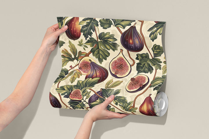 Ivory fig and leaf wallpaper with purple vintage botanical pattern shown in a rolled sample.