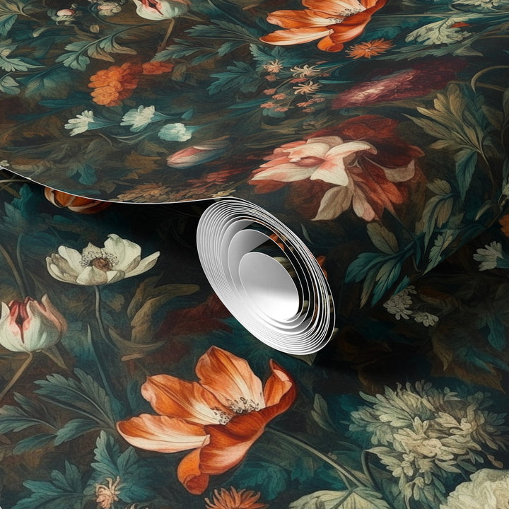 Orange and cream painterly botanical wallpaper with delicate flowers and lush foliage shown in a rolled wallpaper sample.