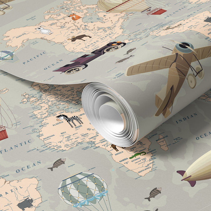 Neutral world map wallpaper roll with vintage travel illustrations, airplanes, hot air balloons, and classic adventure design
