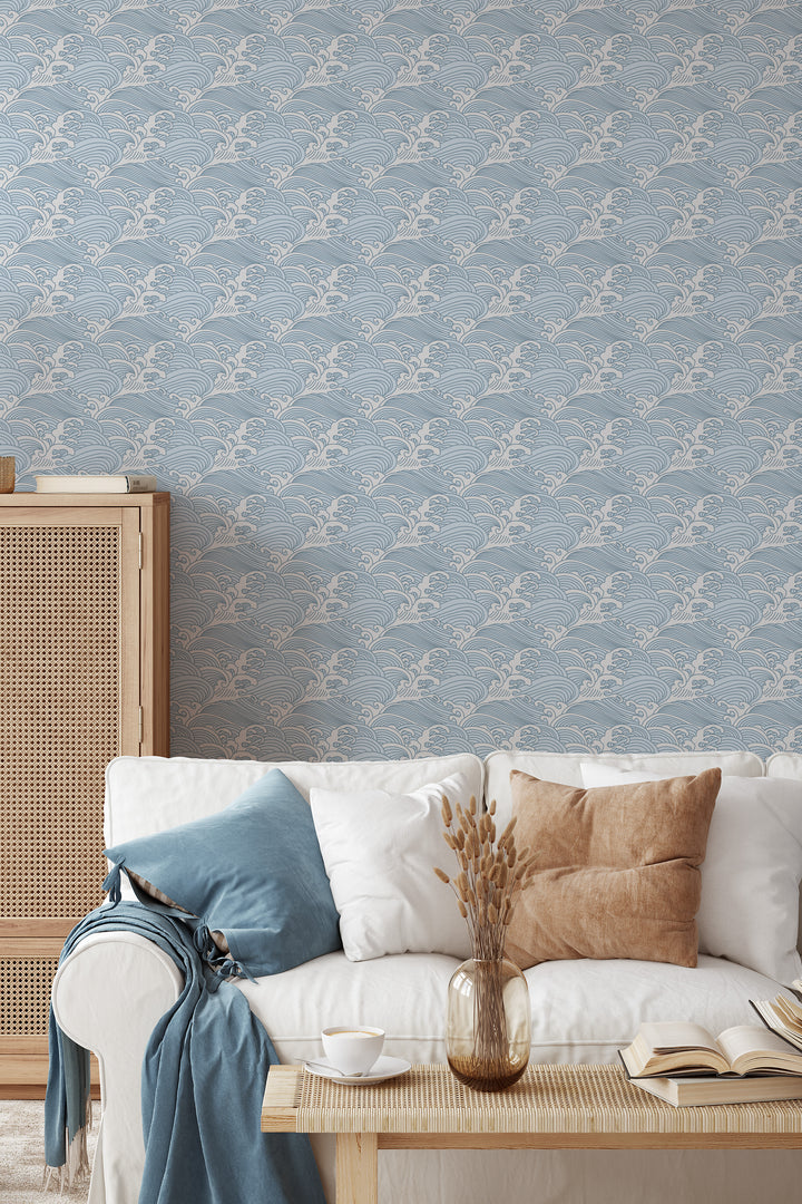 Living room with cool blue Japanese wave wallpaper featuring a calm ocean pattern and natural wood decor