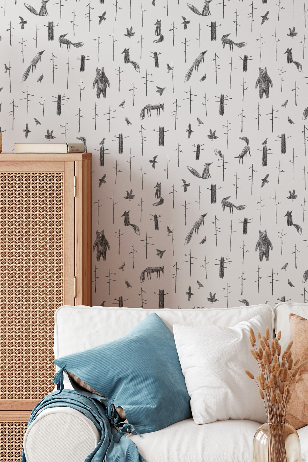Wallpaper with animal pattern on a wall with a chair and table.