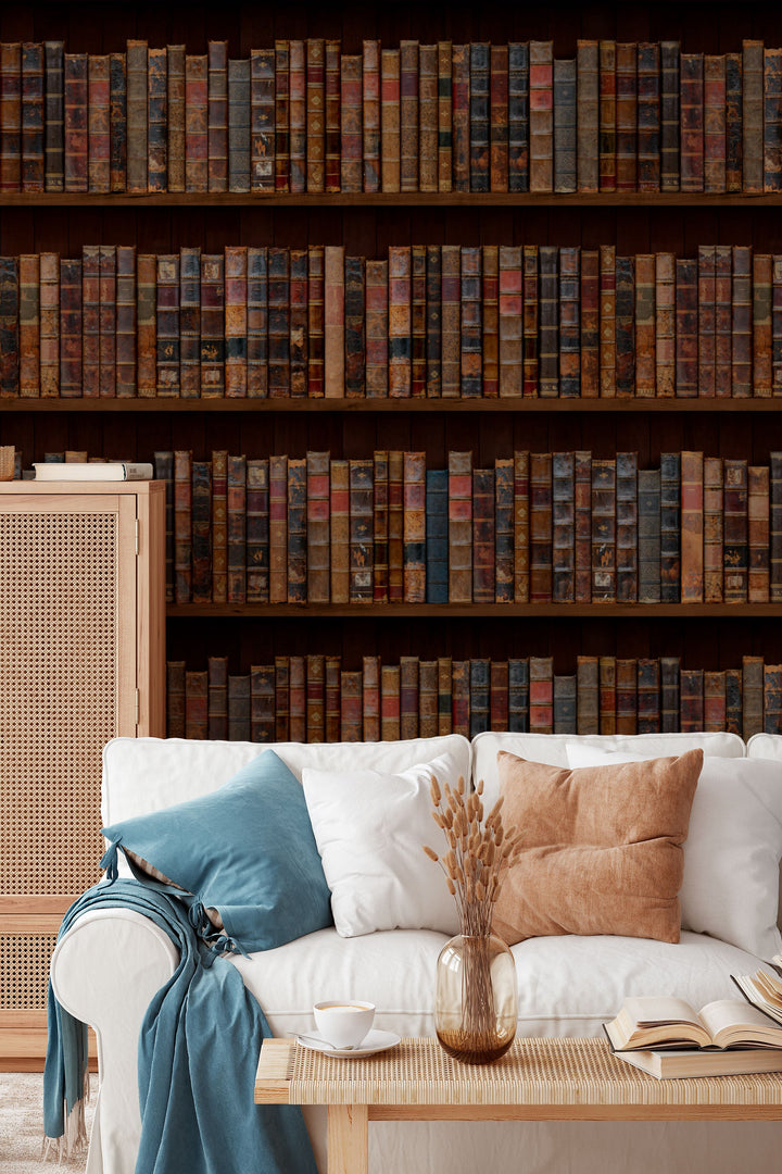 wallpaper for wlls murals Shelves filled with vintage books with worn leather bindings
