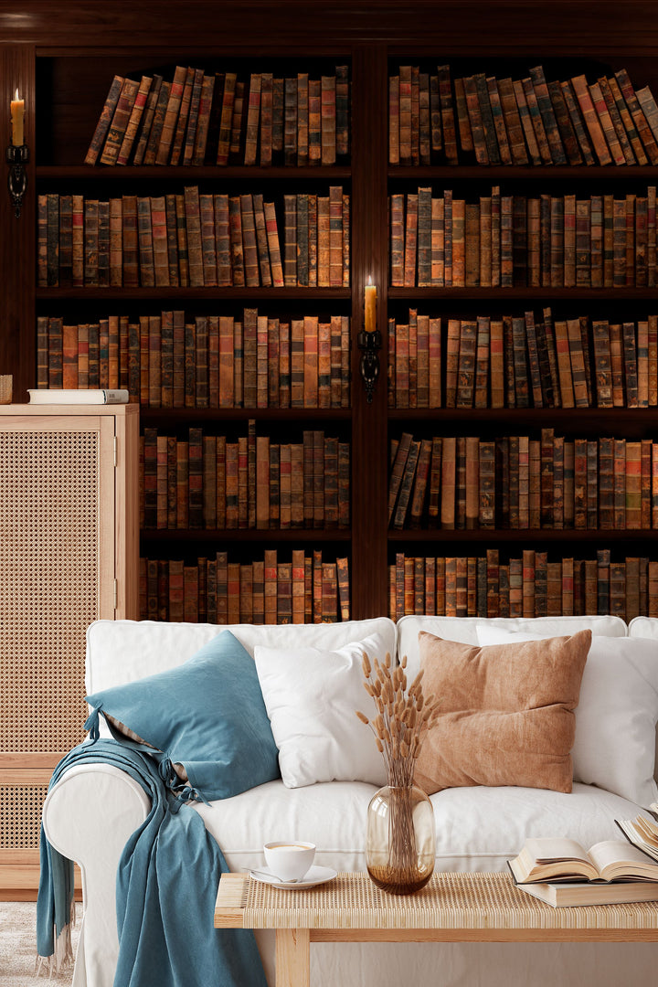 Wallpaper for walls Library bookshelf filled with old books in a dimly lit room.