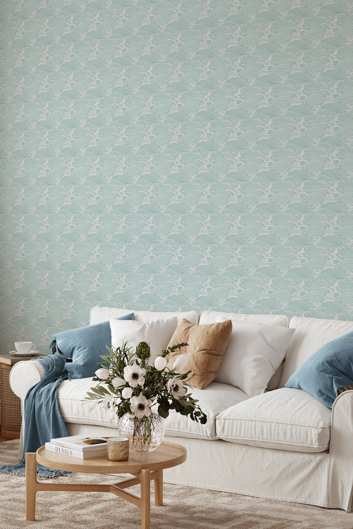 Living room with light aqua Japanese wave wallpaper featuring a traditional ocean pattern and soft neutral decor