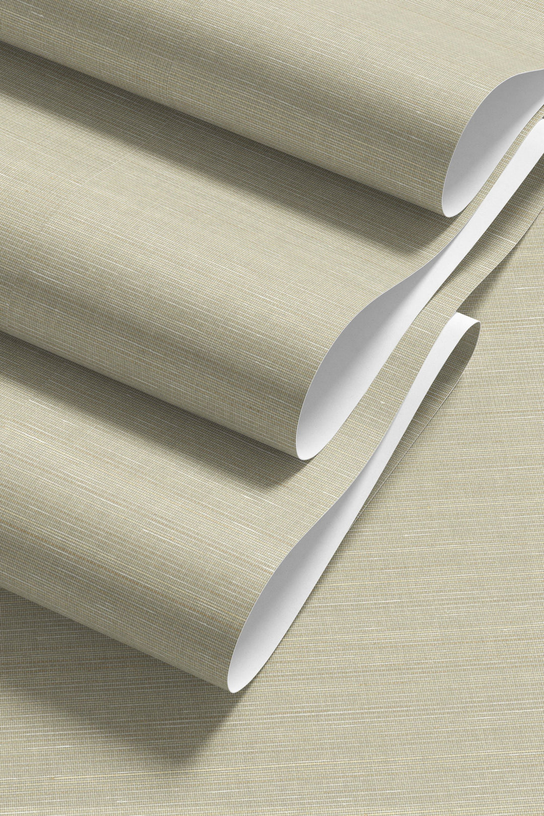 Faux abaca grasscloth wallpaper with natural woven fiber texture and soft horizontal tonal variation. Beige wallpaper roll with a silver tool on a matching background
