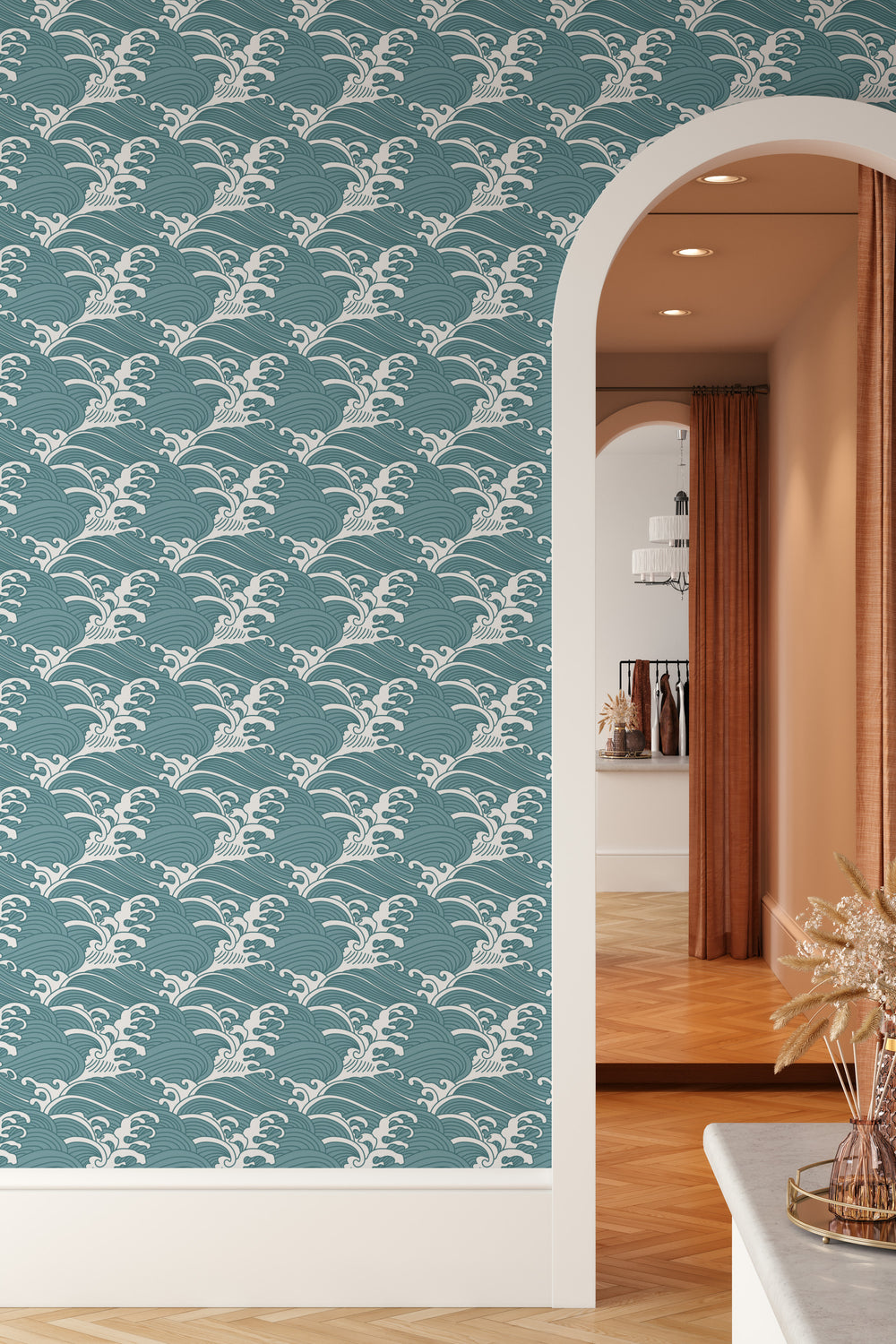 Wall with teal blue Japanese wave wallpaper featuring a bold traditional ocean pattern and modern arched doorway
